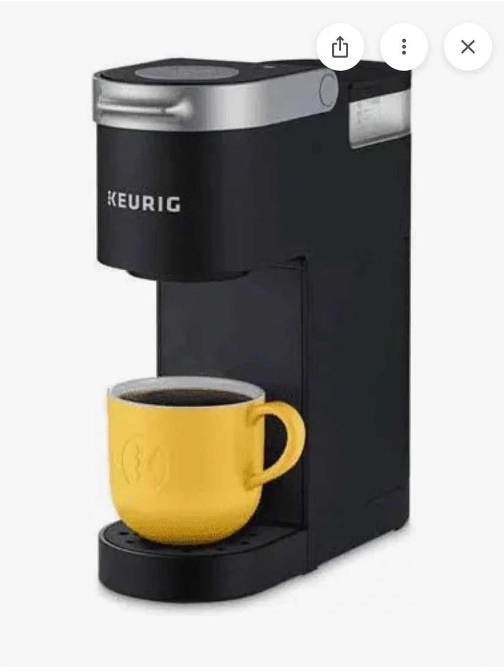 Keurig Black Brewer with Yellow Mug and Colorful Pod Display